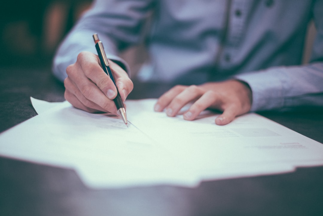 Experienced insurance lawyer in Houston examining a client's property damage documents after a storm